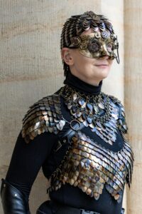 Woman with body armour to symbolise de-armouring