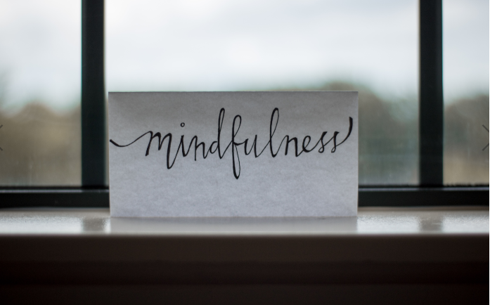Mindfulness sign on windowsill
